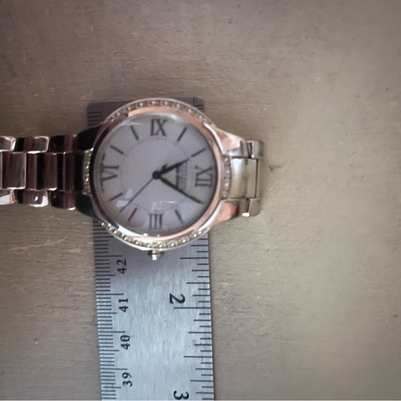 CITIZEN ECODRIVE SILVER TONE BRACET WATCH W/ TINY DIAMOND CHIP ACCENTS. - Picture 8 of 16